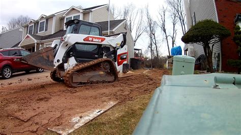 Moving Dirt with Skid Steer Bobcat T66 